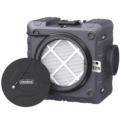 A robust gray portable air purifier with a carrying handle and circular front filter opening, shown with a black branded filter cover placed in front. The tag shown reads 23 ft in reference to the cord length. The air outlet is visible on the right side of the unit.